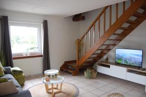 TV a/nebo společenská místnost v ubytování Appartement Fleurs des champs - Esc'Appart