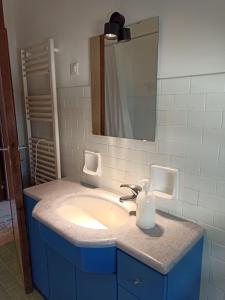 a bathroom with a sink and a mirror at Casa Vacanza Gabriella in Montesilvano +15 photos
