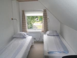 Een bed of bedden in een kamer bij Riis Feriepark