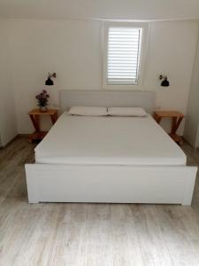 A bed or beds in a room at I Nidi di Colombo