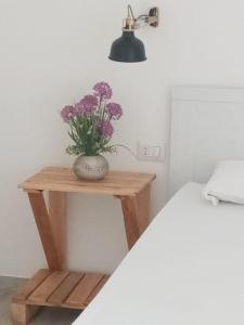 A bed or beds in a room at I Nidi di Colombo