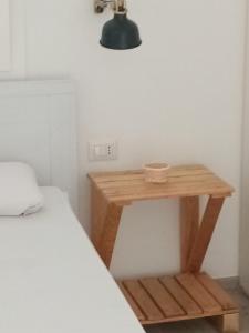 A bed or beds in a room at I Nidi di Colombo