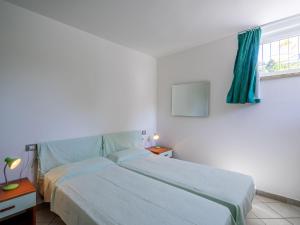 Posteľ alebo postele v izbe v ubytovaní Apartment Residenza Agrifoglio-15 by Interhome