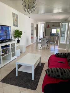 a living room with a couch and a table at Les milles feuilles in Marseille