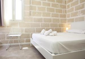 Posteľ alebo postele v izbe v ubytovaní Casa Maja rooms & suites
