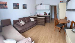 a living room with a couch and a table at Gdynia99 in Gdynia +23 photos
