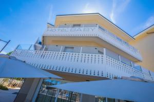 a building with a hotel baby sign on it at Hotel Baby in Rimini