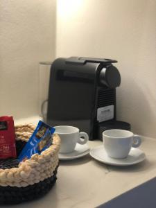 Príslušenstvo na prípravu kávy alebo čaju v ubytovaní Candele Suites