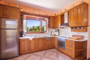 Η κουζίνα ή μικρή κουζίνα στο Villa Emilia