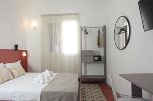 Posteľ alebo postele v izbe v ubytovaní Casa Maja rooms & suites