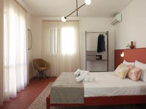 Posteľ alebo postele v izbe v ubytovaní Casa Maja rooms & suites