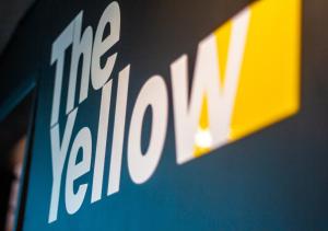 a close up of the kia logo on a wall at The Yellow by DOT Boutique in Guadalajara