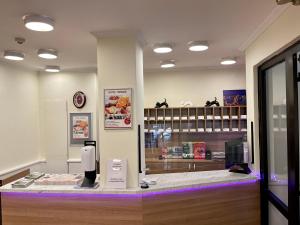 a store with a hair dryer on a counter at Thomas Hotel Budapest in Budapest