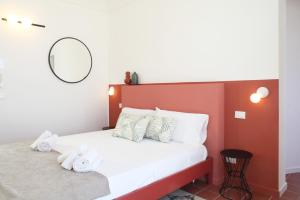 Posteľ alebo postele v izbe v ubytovaní Casa Maja rooms & suites