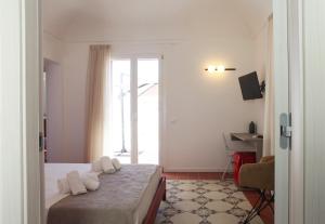 Posteľ alebo postele v izbe v ubytovaní Casa Maja rooms & suites