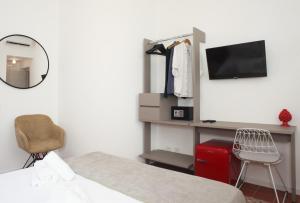Televízia a/alebo spoločenská miestnosť v ubytovaní Casa Maja rooms & suites