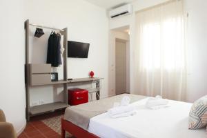 Posteľ alebo postele v izbe v ubytovaní Casa Maja rooms & suites