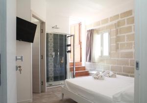 Posteľ alebo postele v izbe v ubytovaní Casa Maja rooms & suites