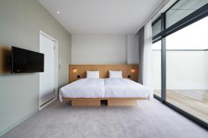 Postel nebo postele na pokoji v ubytování MUSTARD HOTEL SHIMOKITAZAWA + 37 fotografií
