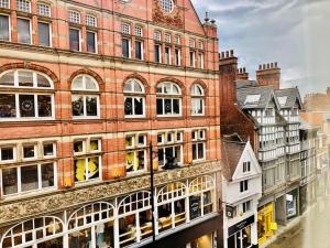 a large brick building with lots of windows at NG1 Lofts in Nottingham