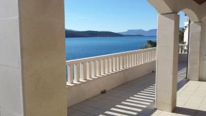 a view of the water from the balcony of a building at Villa M in Neum