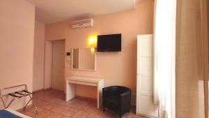 TV a/nebo společenská místnost v ubytování Hotel Rita Major
