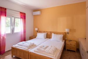 A bed or beds in a room at Villa Kiara