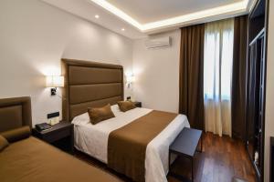 Postel nebo postele na pokoji v ubytování Hotel Palma