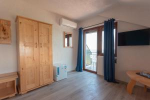 a living room with a door and a window at Black Sea View Costinesti in Costinesti