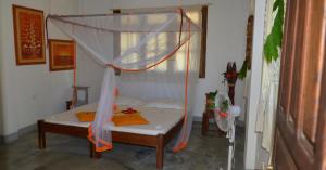 Rúm í herbergi á Sambatra Bed and Breakfast +22 myndir