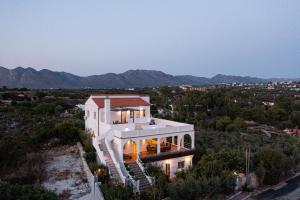 a house with a view of the mountains at Villa Kiara in Tersanas