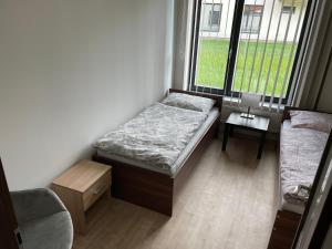 Postel nebo postele na pokoji v ubytování Apartmán za kostelem Čeladná