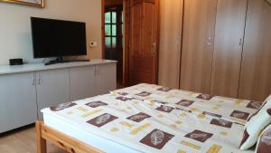 Postel nebo postele na pokoji v ubytování Ilona apartmanok