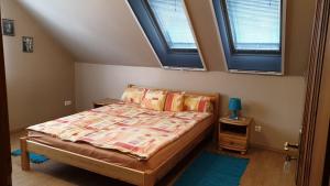 Postel nebo postele na pokoji v ubytování Ilona apartmanok