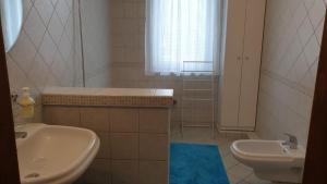 Koupelna v ubytování Ilona apartmanok
