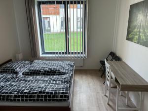 Postel nebo postele na pokoji v ubytování Apartmán za kostelem Čeladná