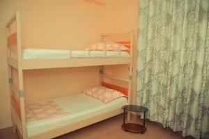 Posteľ alebo postele v izbe v ubytovaní Central Hostel