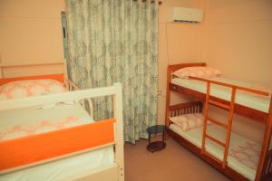 Posteľ alebo postele v izbe v ubytovaní Central Hostel