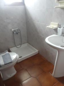 a bathroom with a shower and a toilet and a sink at Magda Studios - Double Bed Room N4 in Zagora