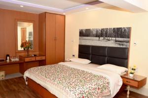Voodi või voodid majutusasutuse Hotel Centre Point toas