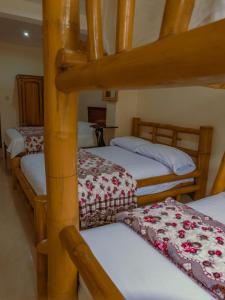 Postel nebo postele na pokoji v ubytování Hostal Poseidon