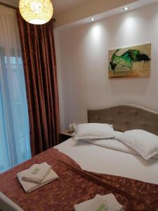 Ένα ή περισσότερα κρεβάτια σε δωμάτιο στο Casa Constantin