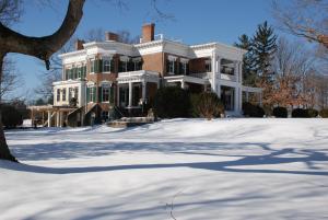 a large house with snow in front of it at Rockwood Manor Bed & Breakfast in Dublin