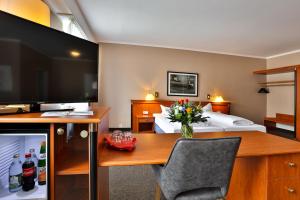 TV a/nebo společenská místnost v ubytování Hotel Quellenhof