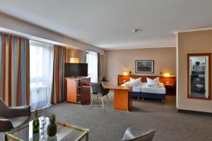 TV a/nebo společenská místnost v ubytování Hotel Quellenhof