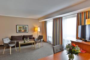 TV a/nebo společenská místnost v ubytování Hotel Quellenhof