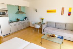 a living room with a couch and a table at Marina Club Lagos Resort in Lagos