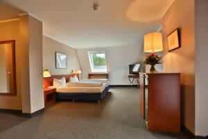 Postel nebo postele na pokoji v ubytování Hotel Quellenhof