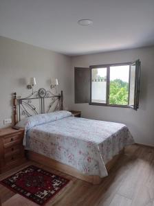 A bed or beds in a room at OZAMIZ Urdaibai