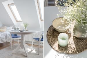 une salle à manger avec une table et un vase de fleurs dans l'établissement Baltiq Spot Rewa, à Rewa